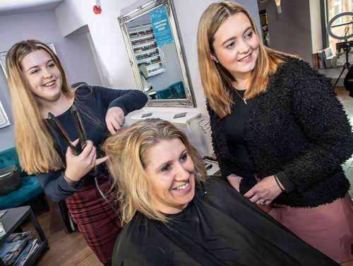 Apprentice Jade Walker styling Lyndsey Pavan's hair under the guidance of Becci Evemy
