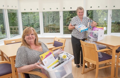 Jill Quinn and Sheila Blacklock with fortnightly tea boxes