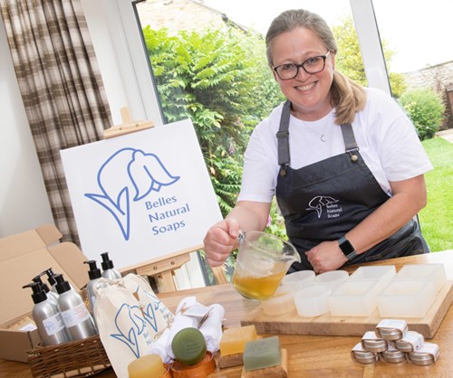 woman making soap at belles natural soaps