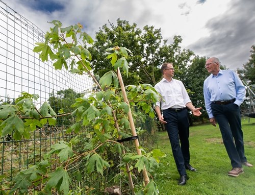 David Rafelt, Vice Chairman of Scorton Parish Council, with District Councillor Philip Wicks discussing the newly planted saplings.