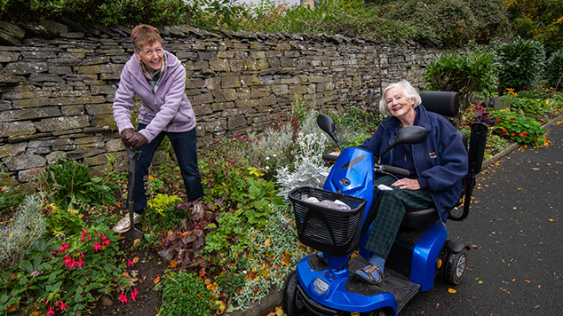 Gillian Aitken (left), a volunteer at Leyburn Arts and Community Centre, tends the garden with resident, Brenda Askew (right)